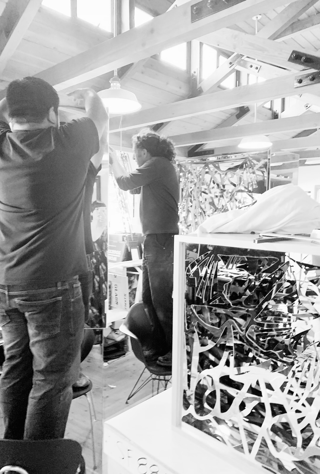 Drue Kataoka Studios team fitting reflective mirror panels during assembly