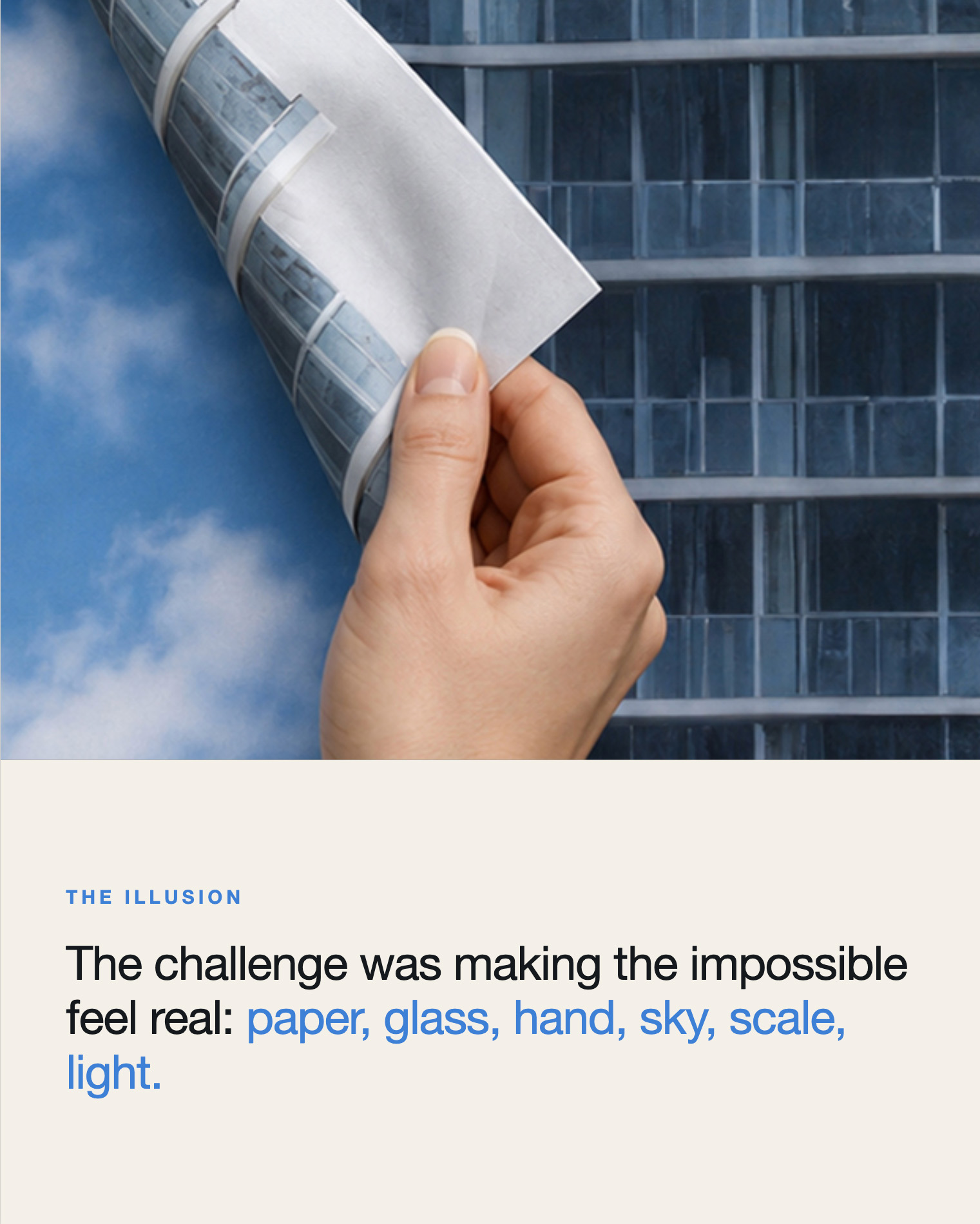 The Illusion — a hand pinches the curling paper edge of the facade against blue sky: paper, glass, hand, sky, scale, light