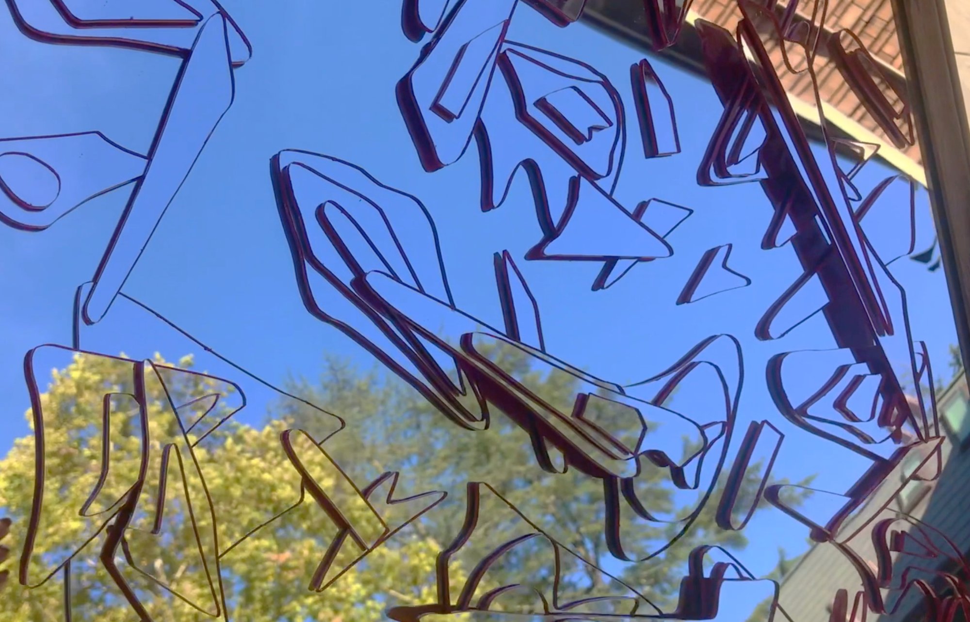 Cloud Islands — layered mirror work reflecting blue sky and foliage