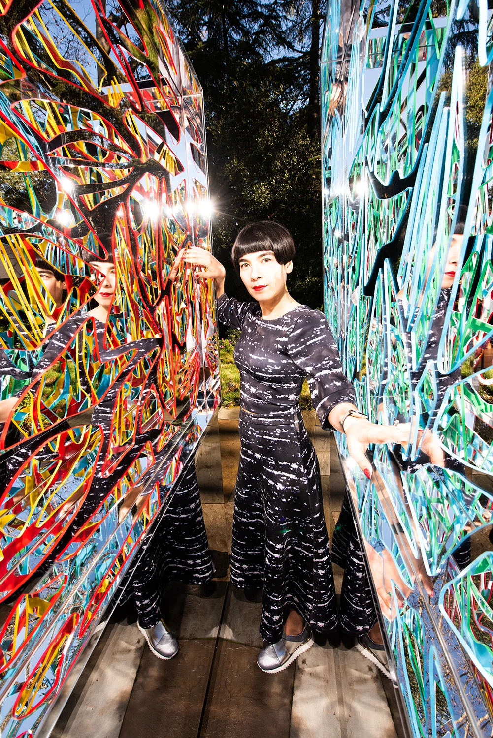 Drue Kataoka between two Ambrosia artworks
