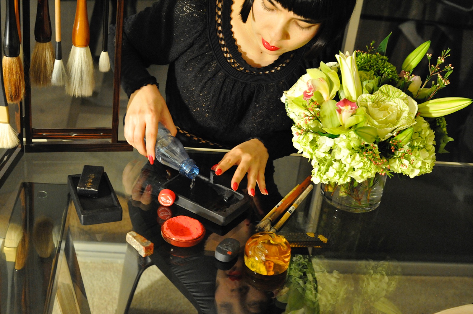 Drue takes the melted Davos water and creates the ink for the art