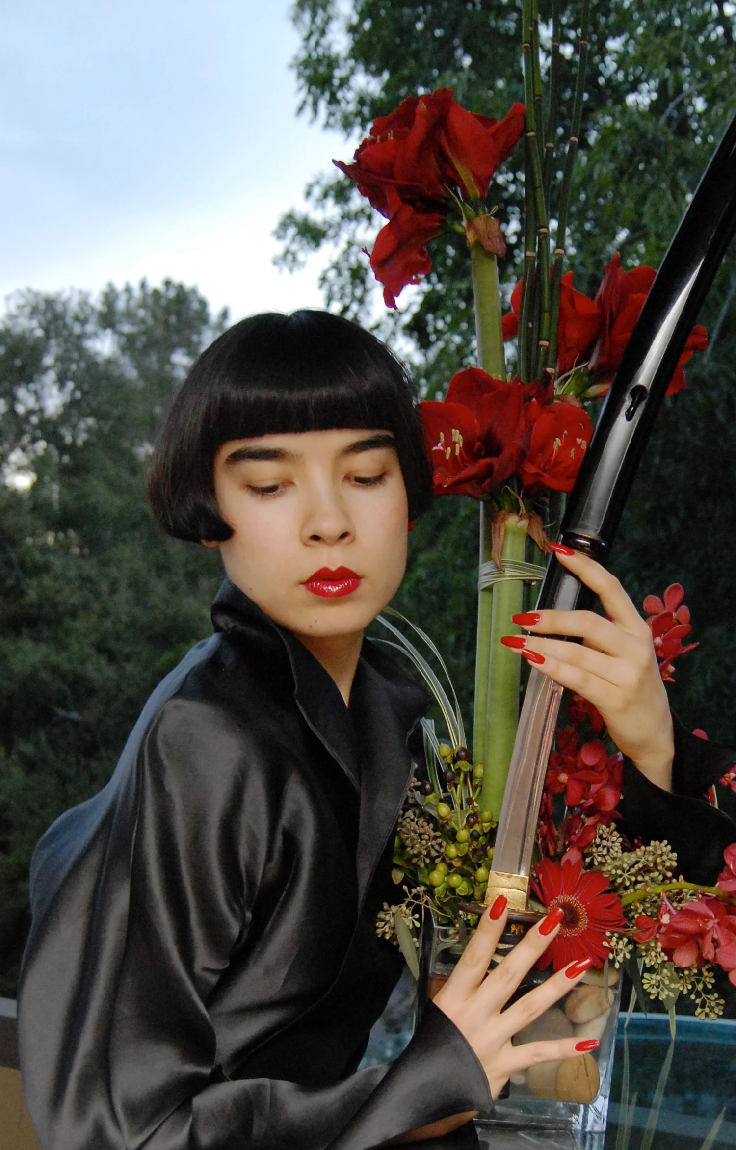 Drue with the Kataoka family samurai sword and red amaryllis